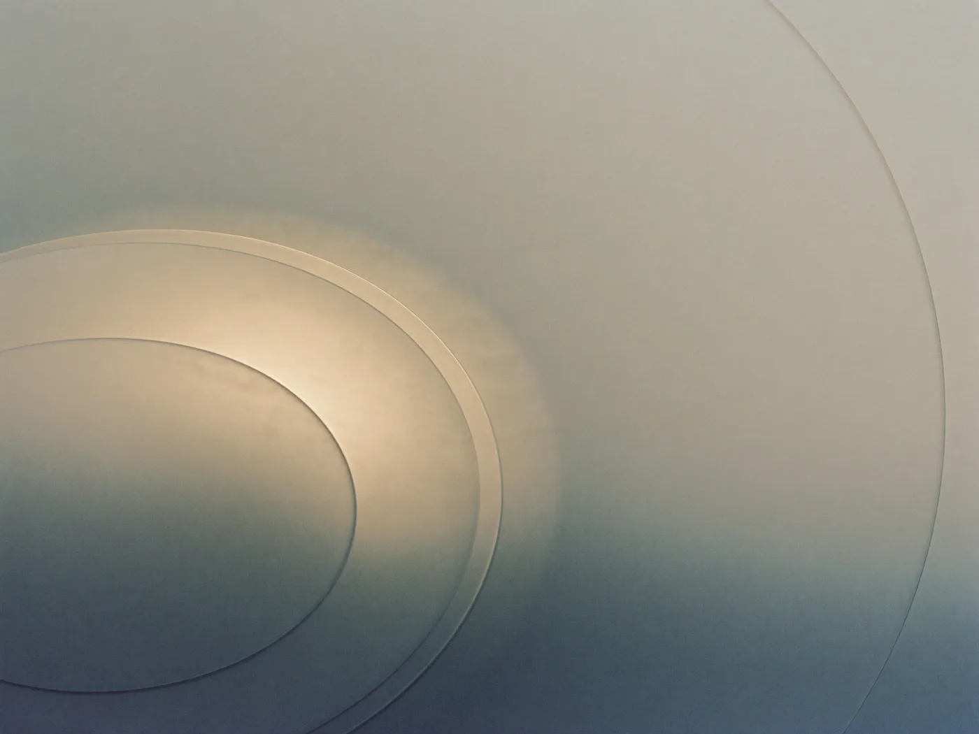 Abstract concentric rings of soft light in warm porcelain tones